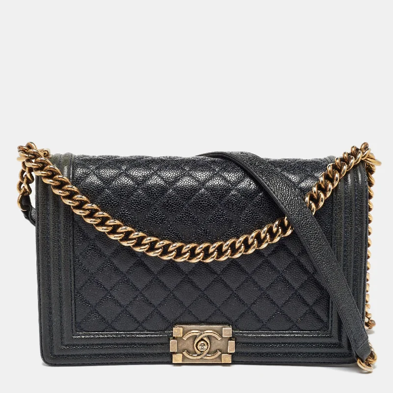 Shoulder bags with bohemian tassel embellishments -Chanel Navy Blue Quilted Caviar Leather New Medium Boy Flap Bag