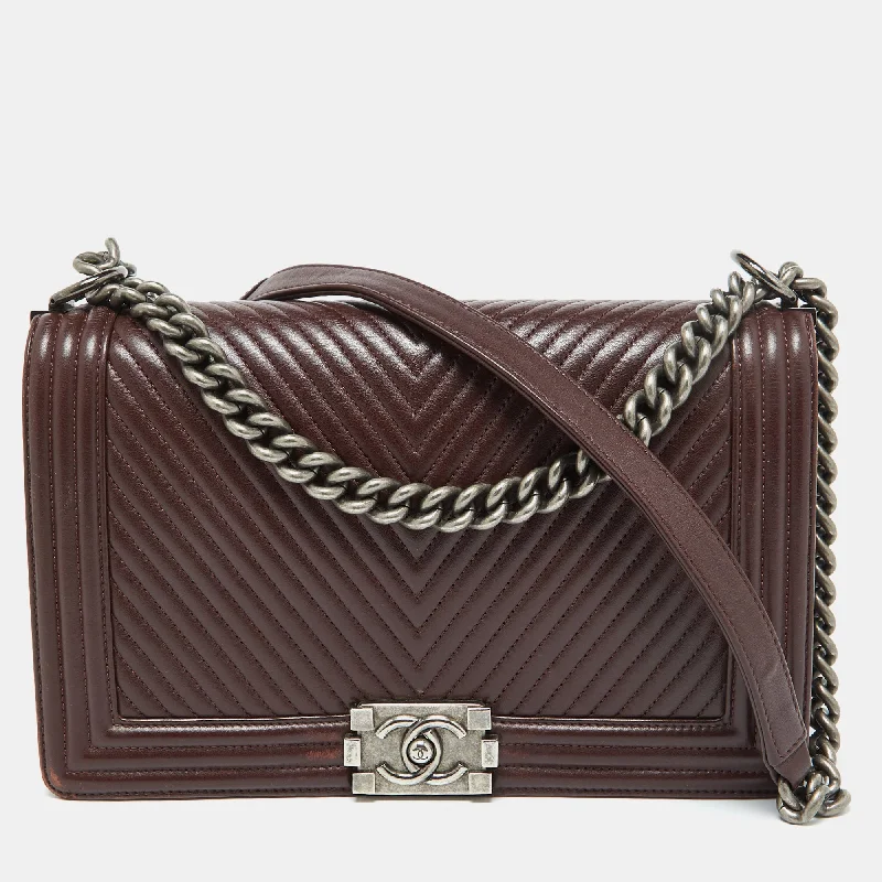 Shoulder bags with playful pom-poms for charm -Chanel Burgundy Chevron Quilted Leather New Medium Boy Flap Bag