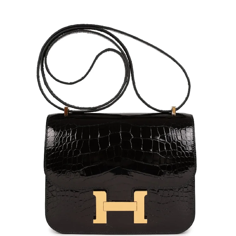 Handle bags with vibrant colors for boldness -Hermes Constance 18 Black Shiny Alligator Gold Hardware