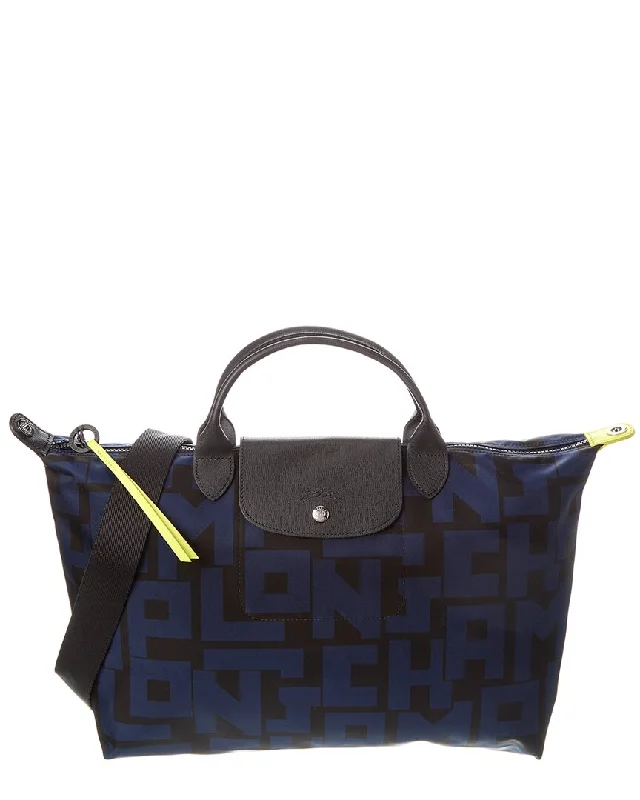 Handle bags with expandable sides for flexibility -Longchamp Le Pliage Sac Porte Nylon Tote